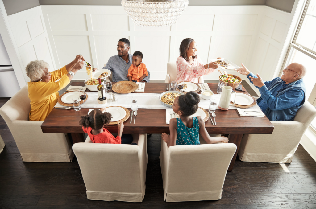 Happy family enjoying breakfast | Chacon Flooring