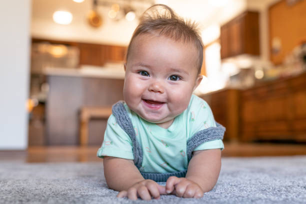 Baby on lying carpet floor | Chacon Flooring